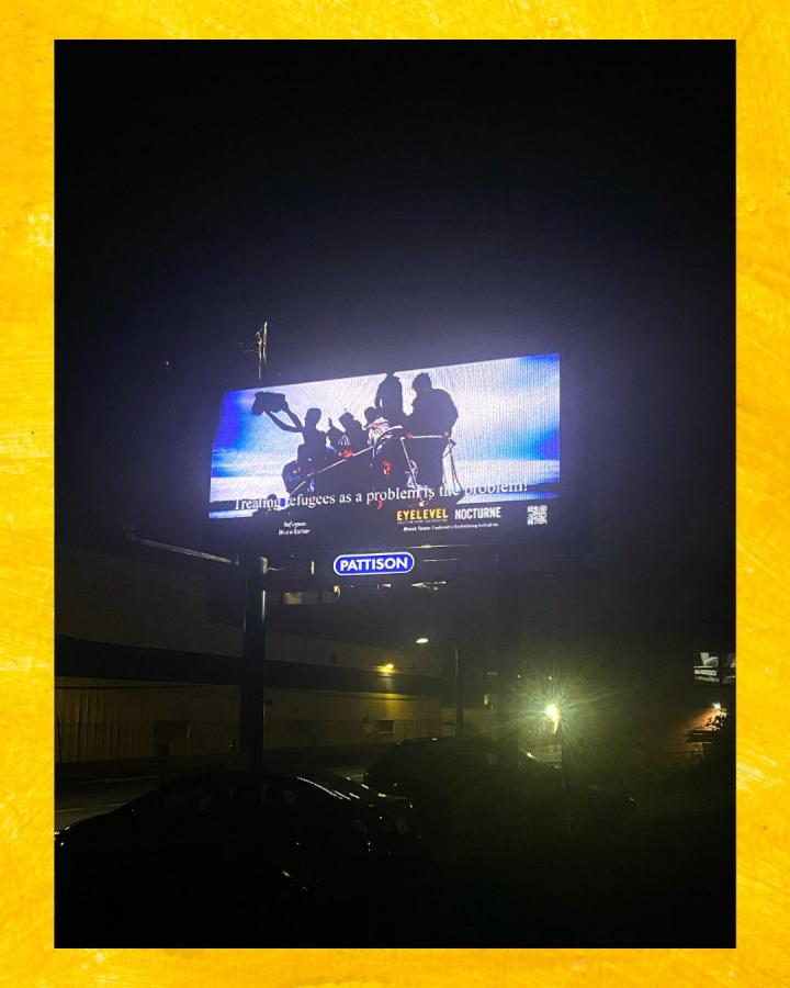 Photograph of Bruce Barber's design for ERI 11 on a digital billboard